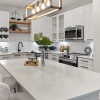 a kitchen with a large white island